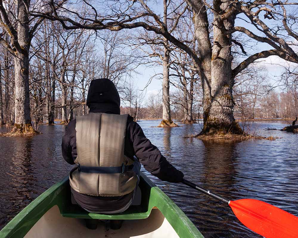 Canoeing during the fifth season in Soomaa National Park, Estonia