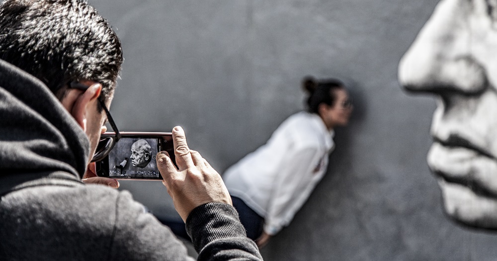 Take in stimulating art at the East Side Gallery in Berlin