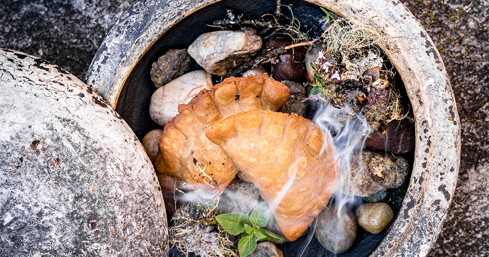 Traditional Austrian meat pastries served at Hotel Sonnhof in St. Veit, SalzburgerLand, with herbs and stone pot presentation.